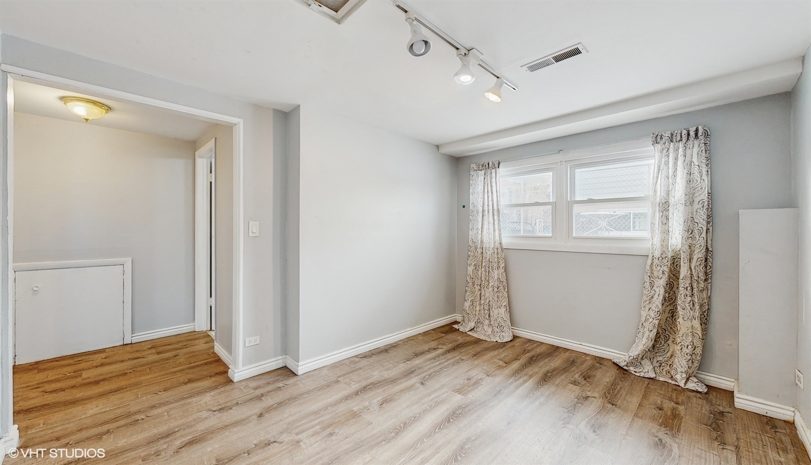 7700 Maple Street Morton Grove, IL 60053 - Photo 18 of 43 a view of empty room with wooden floor