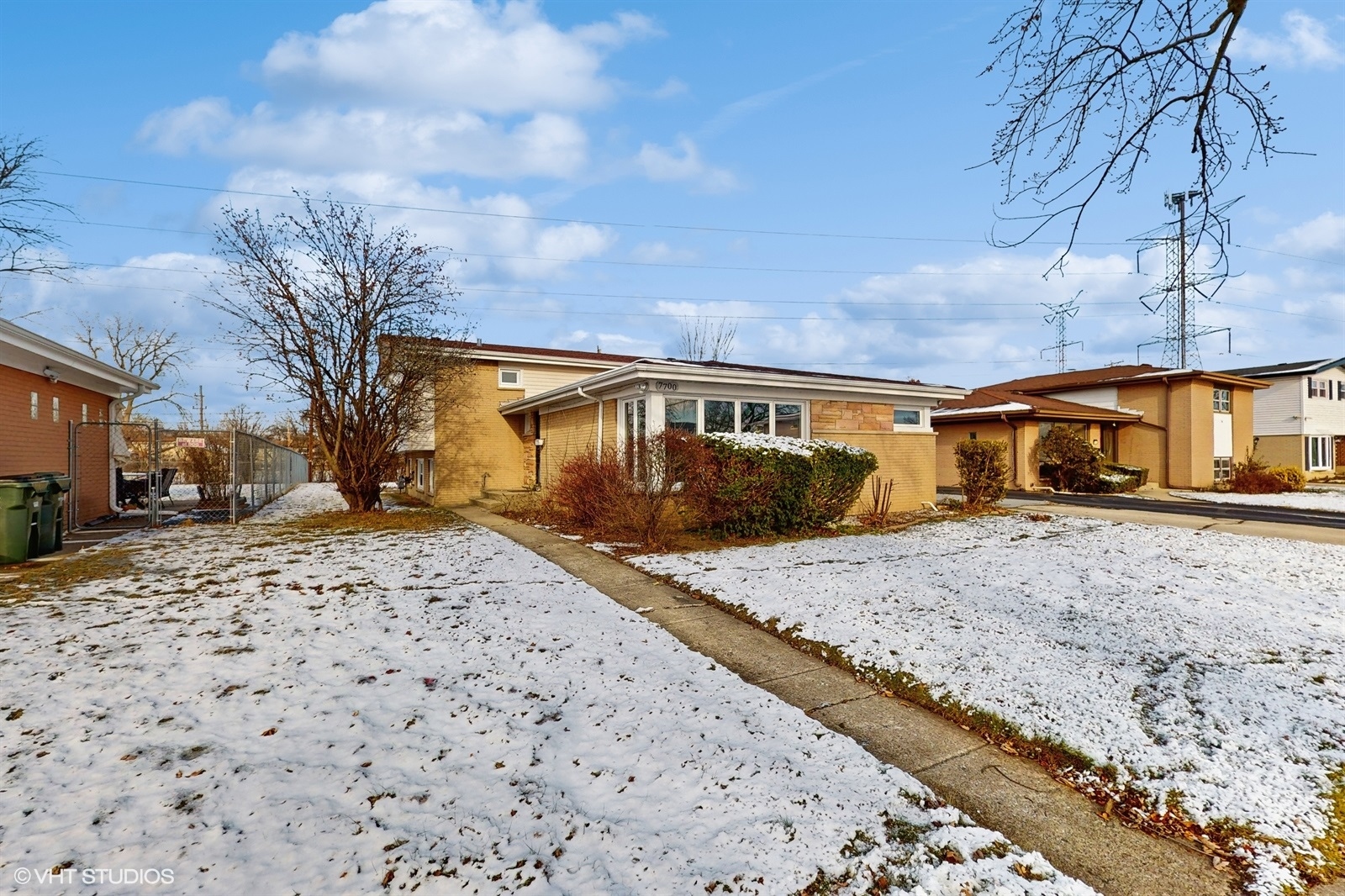 7700 Maple Street Morton Grove, IL 60053 - Photo 2 of 43 a view of a house with snow on the road
