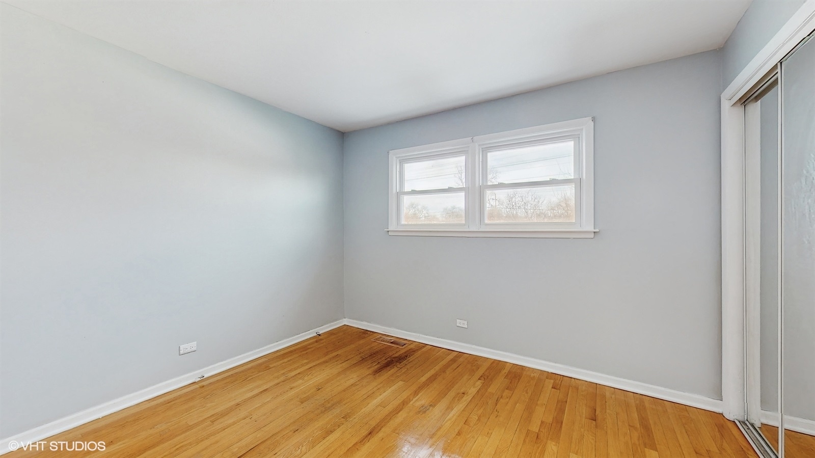 7700 Maple Street Morton Grove, IL 60053 - Photo 25 of 43 a view of empty room with wooden floor
