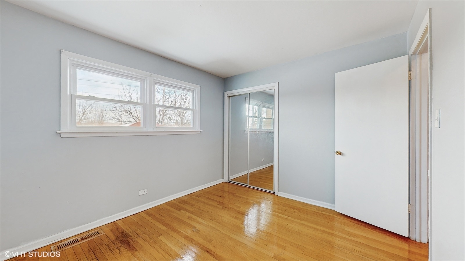 7700 Maple Street Morton Grove, IL 60053 - Photo 27 of 43 a view of empty room with wooden floor