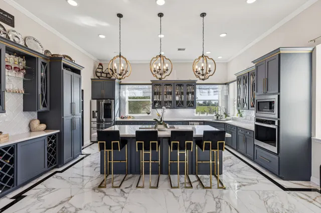 a view of a dining area with furniture window and stainless steel appliances