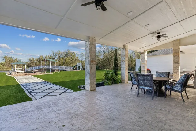 a view of a patio with a yard