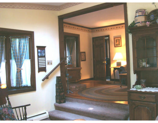 525 Parker Street Springfield, MA 01129 - Photo 4 of 23 a view of a hallway with furniture and windows