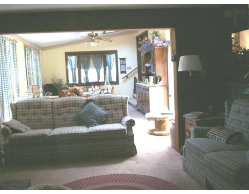 525 Parker Street Springfield, MA 01129 - Photo 5 of 23 a living room with furniture and a chandelier