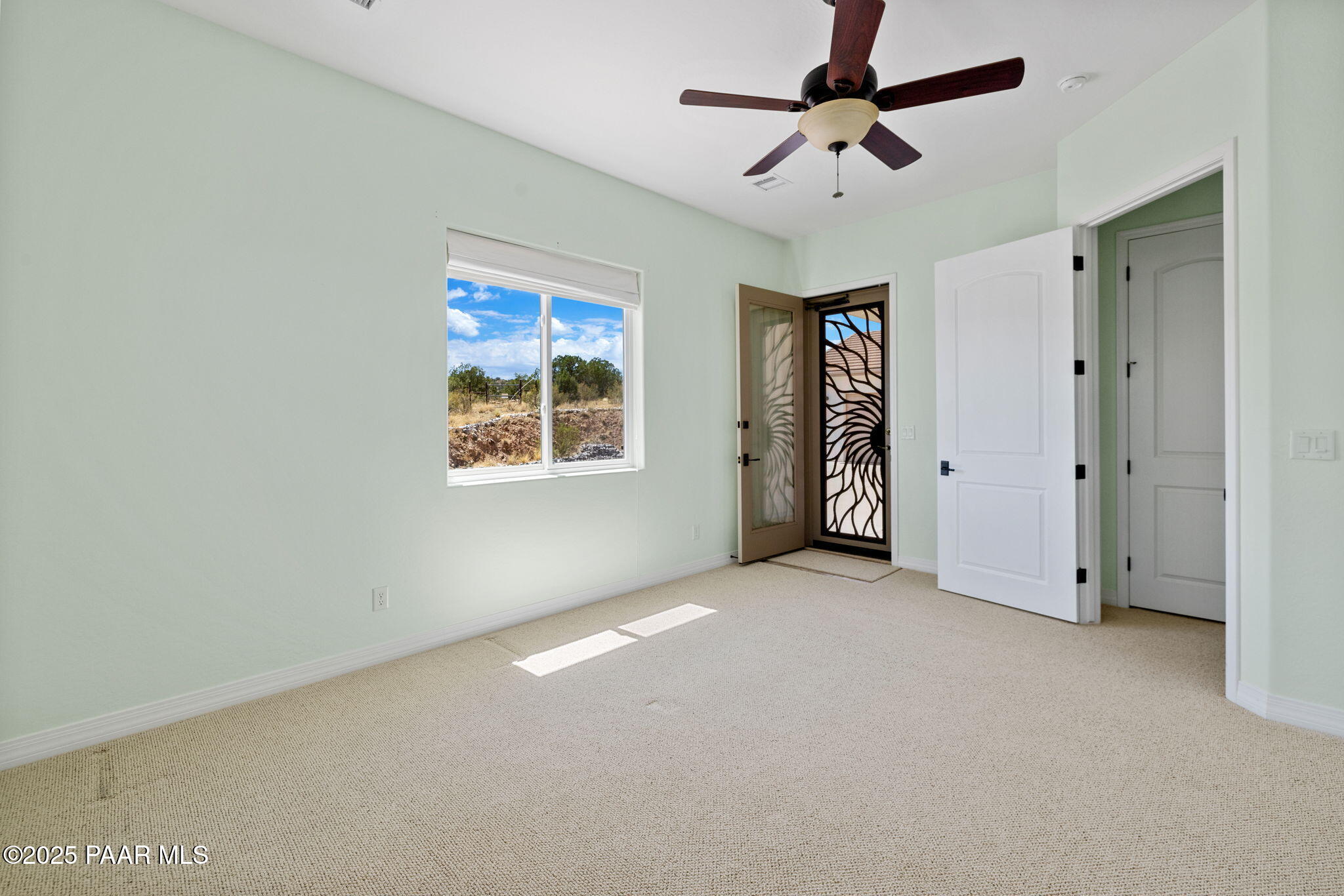5370 North Skyhawk Road Chino Valley, AZ 86323 - Photo 20 of 25 a view of an empty room with a ceiling fan