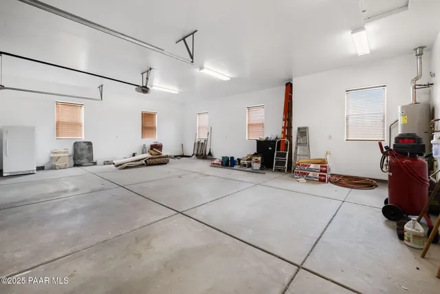 a view of a room with gym equipment and windows