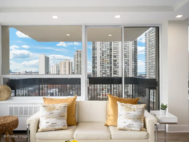a living room with furniture and a large window