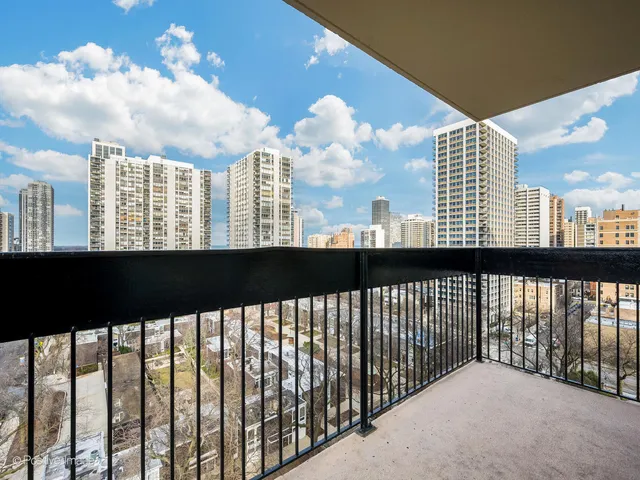 a view of a large building from a balcony