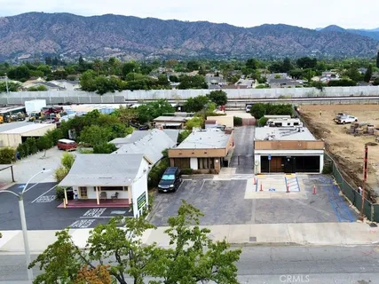 an aerial view of residential houses and outdoor space