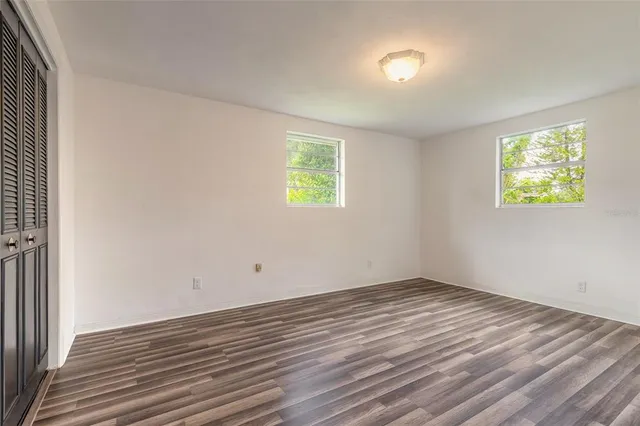 a view of a room with a wooden floor