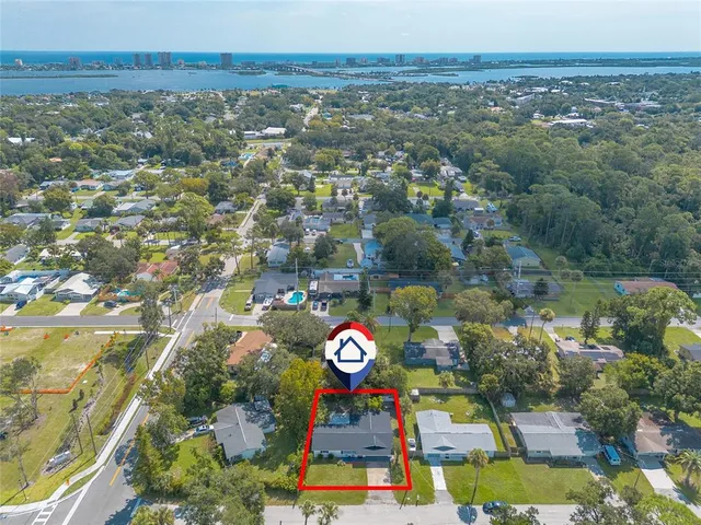 an aerial view of residential house with outdoor space