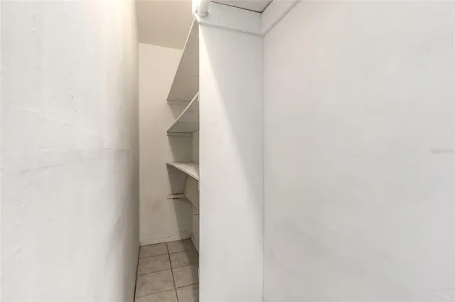 a view of room with window and furniture