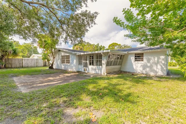 an aerial view of residential house with outdoor space