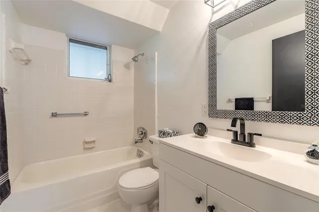 a bathroom with a sink a toilet and a bathtub