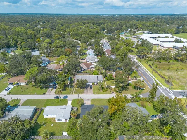 aerial view of a house with a yard