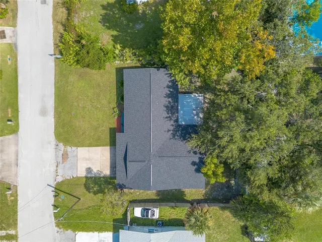 a view of a lake with a house in a yard