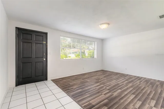 a view of an empty room and window