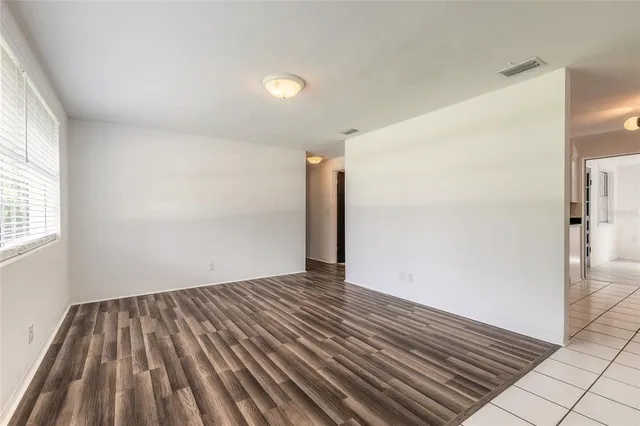 a view of wooden floor in an empty room