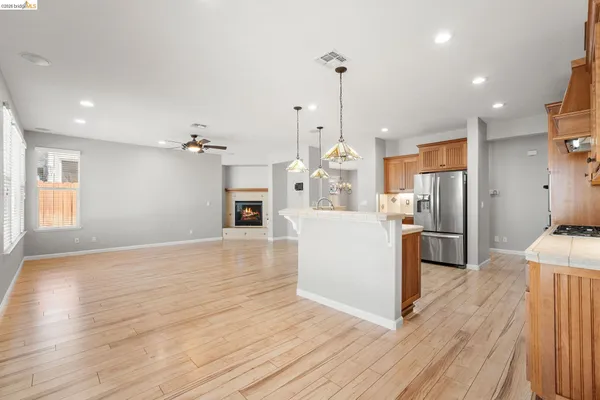 a view of a kitchen with cabinets and stainless steel appliances