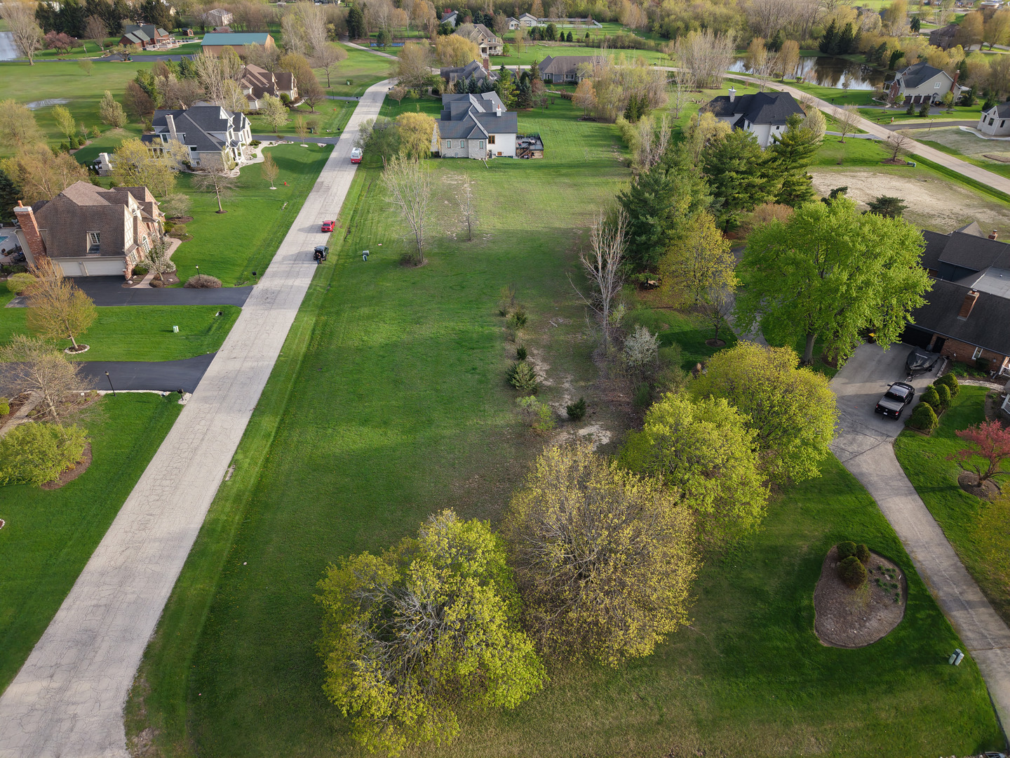 8875 Belfield Road Lakewood, IL 60014 - Photo 6 of 15 an aerial view of residential houses with outdoor space and swimming pool