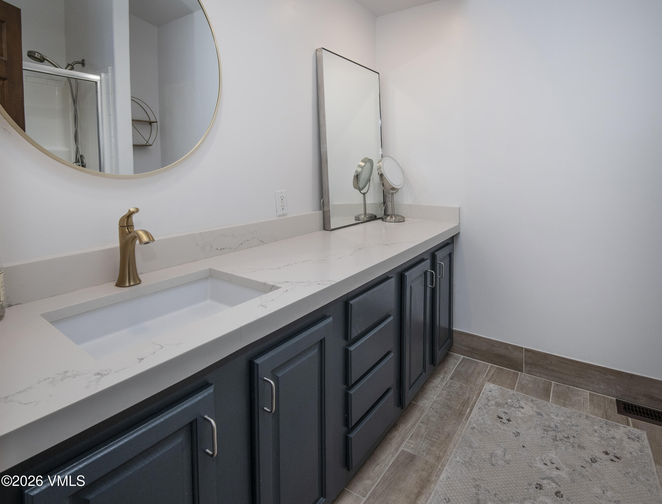 102 Cut Throat Loop Gypsum, CO 81637 - Photo 13 of 37 a utility room with sink and mirror