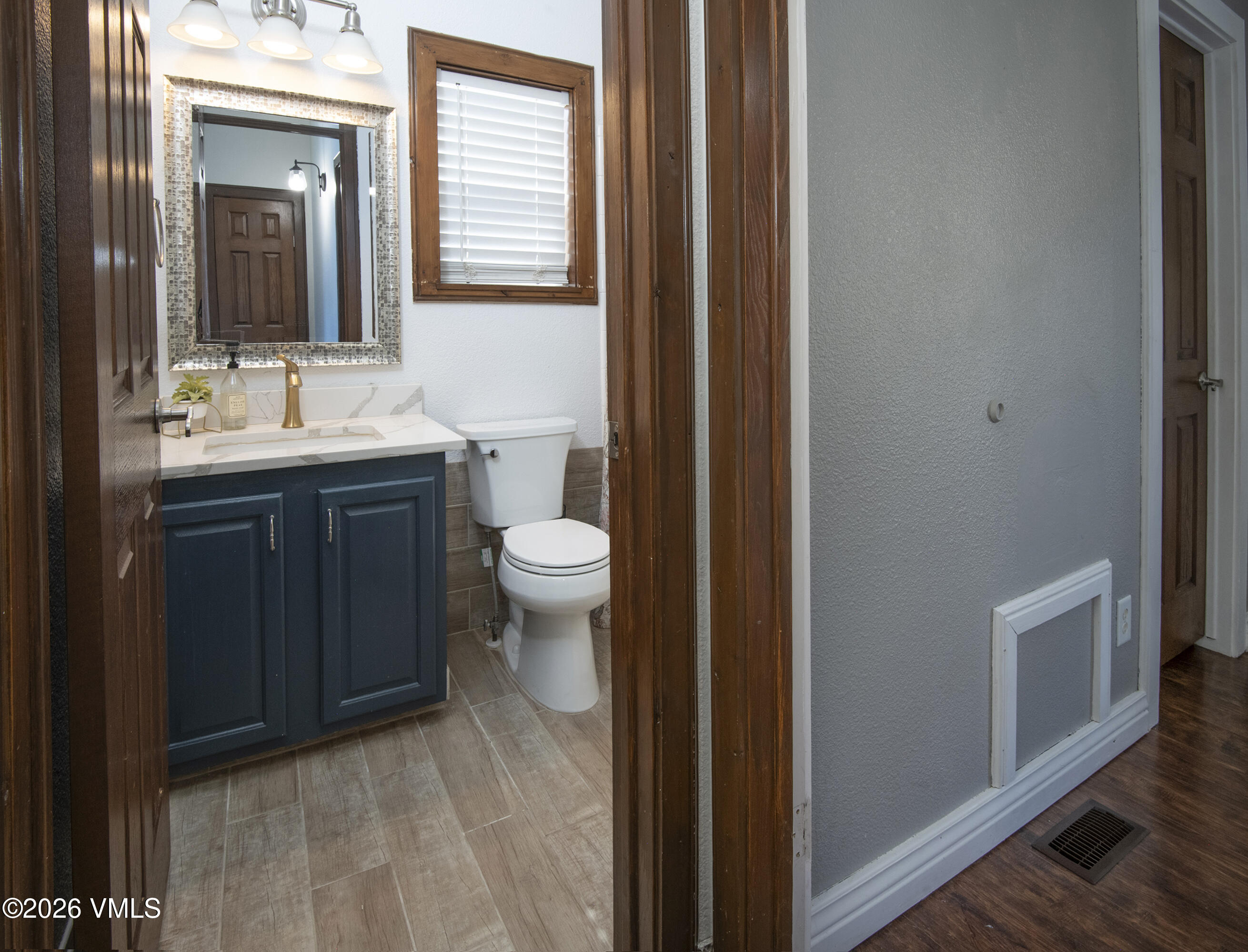 102 Cut Throat Loop Gypsum, CO 81637 - Photo 16 of 37 a bathroom with a sink a toilet and mirror