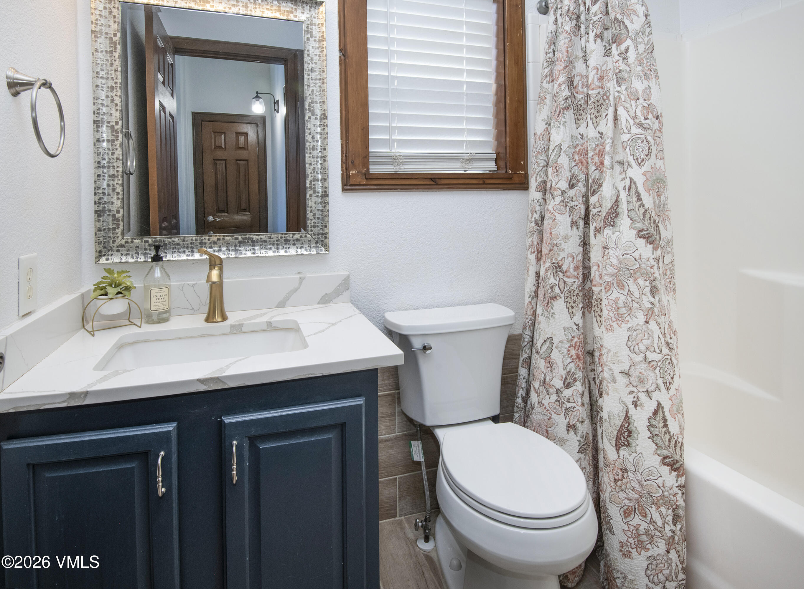 102 Cut Throat Loop Gypsum, CO 81637 - Photo 17 of 37 a bathroom with a toilet a sink and mirror