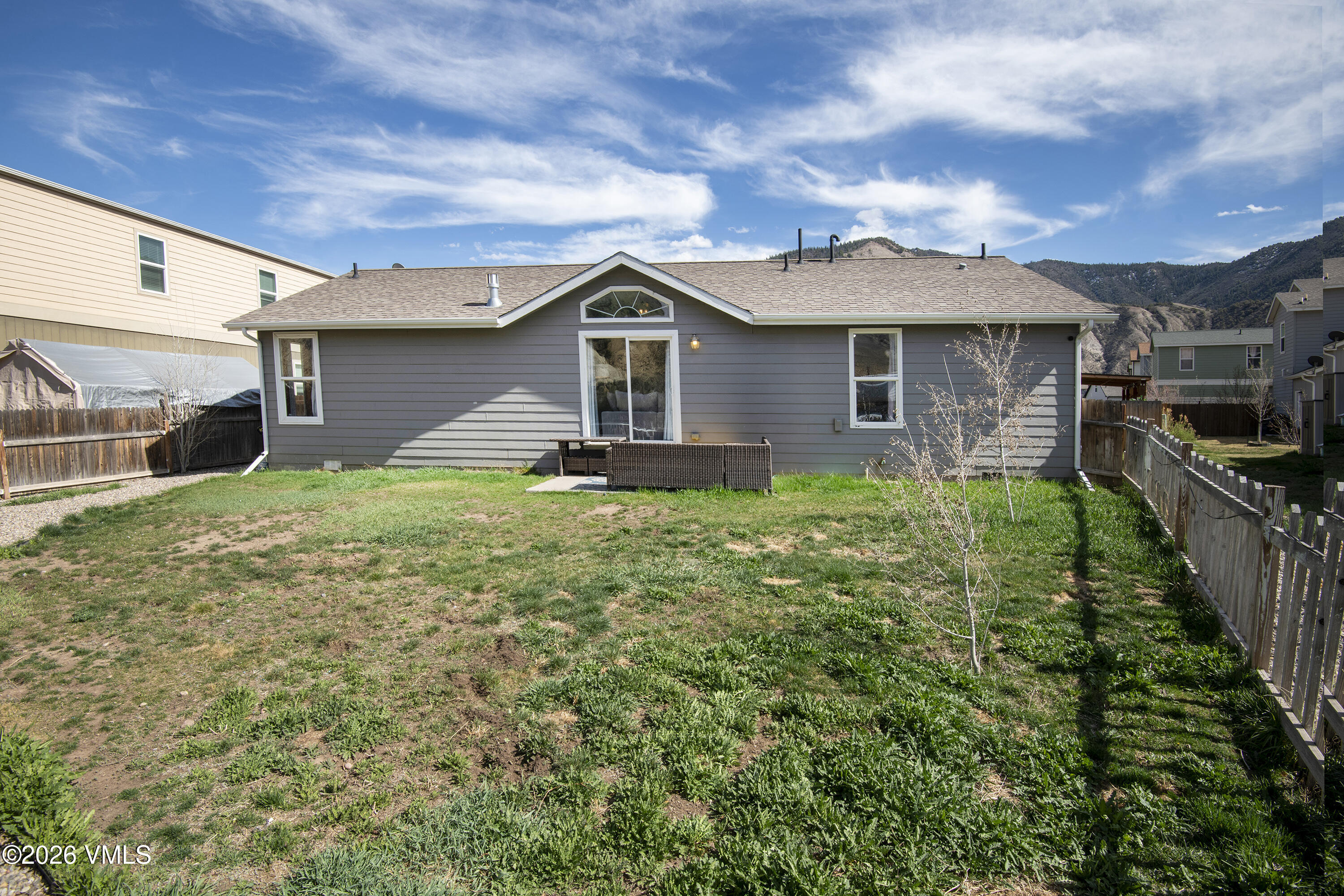 102 Cut Throat Loop Gypsum, CO 81637 - Photo 27 of 37 a view of a yard in front of a house with a large tree