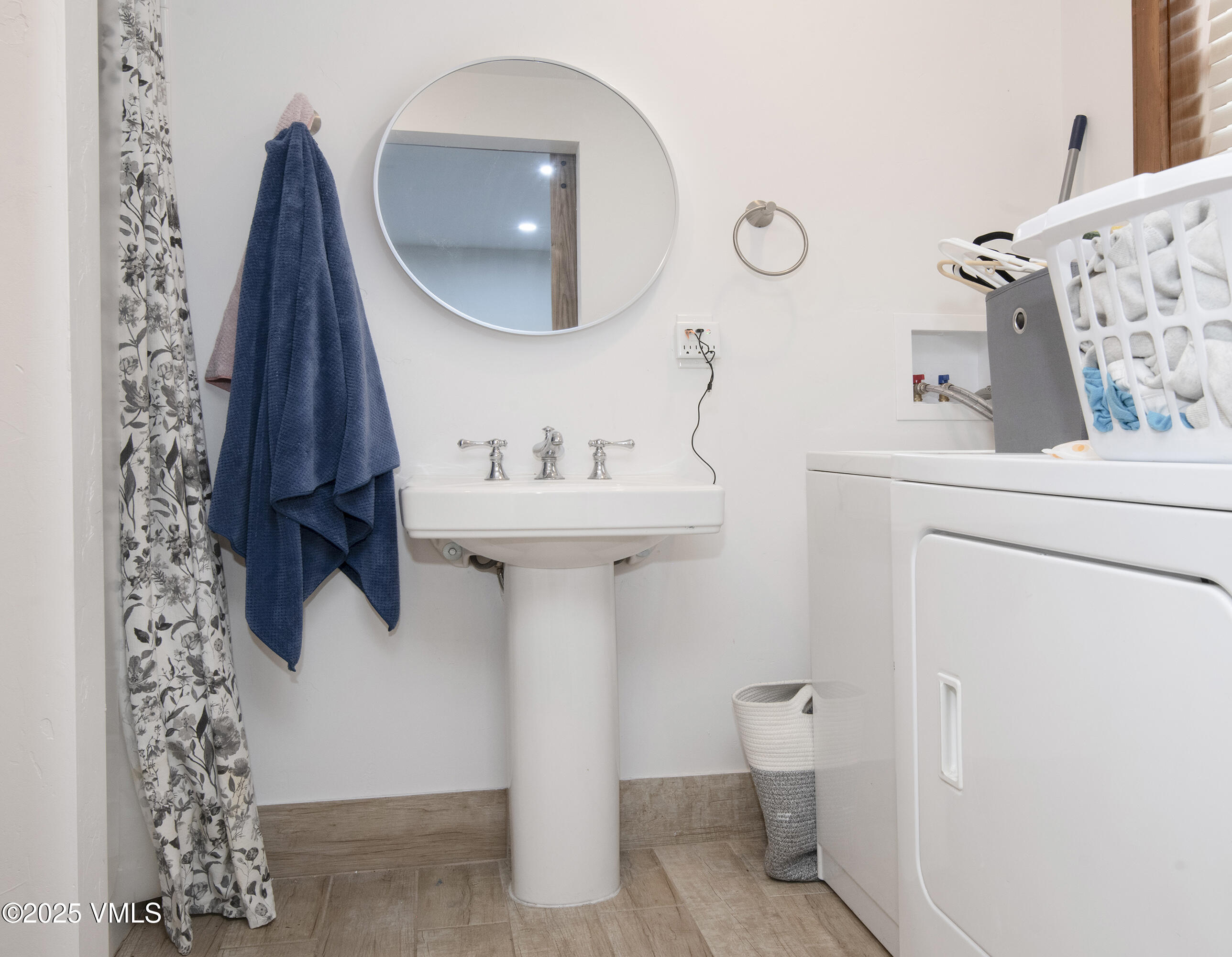 102 Cut Throat Loop Gypsum, CO 81637 - Photo 31 of 37 a bathroom with a sink and mirror with toilet