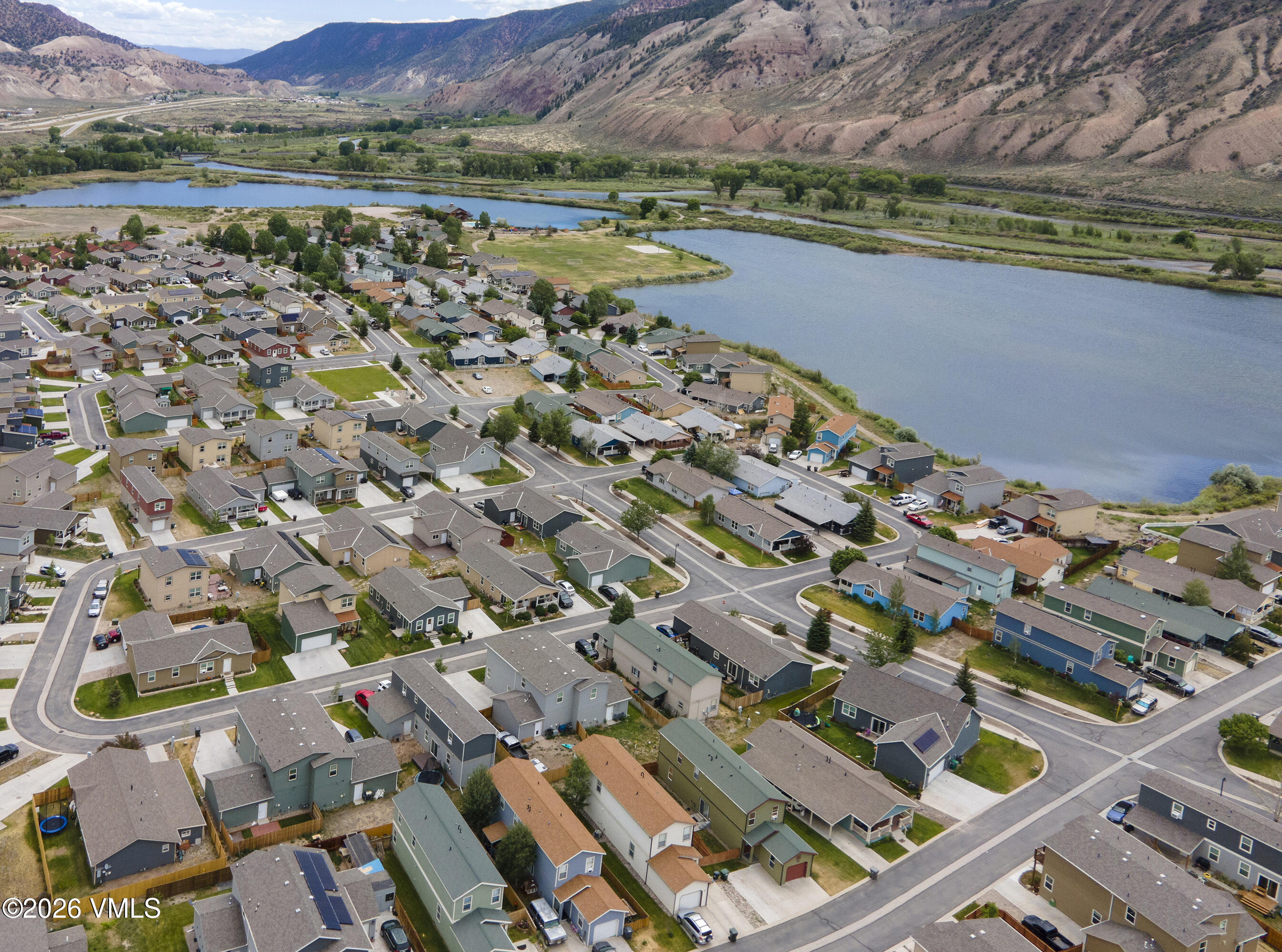 102 Cut Throat Loop Gypsum, CO 81637 - Photo 35 of 37 an aerial view of a city with lots of residential buildings ocean and mountain view in back