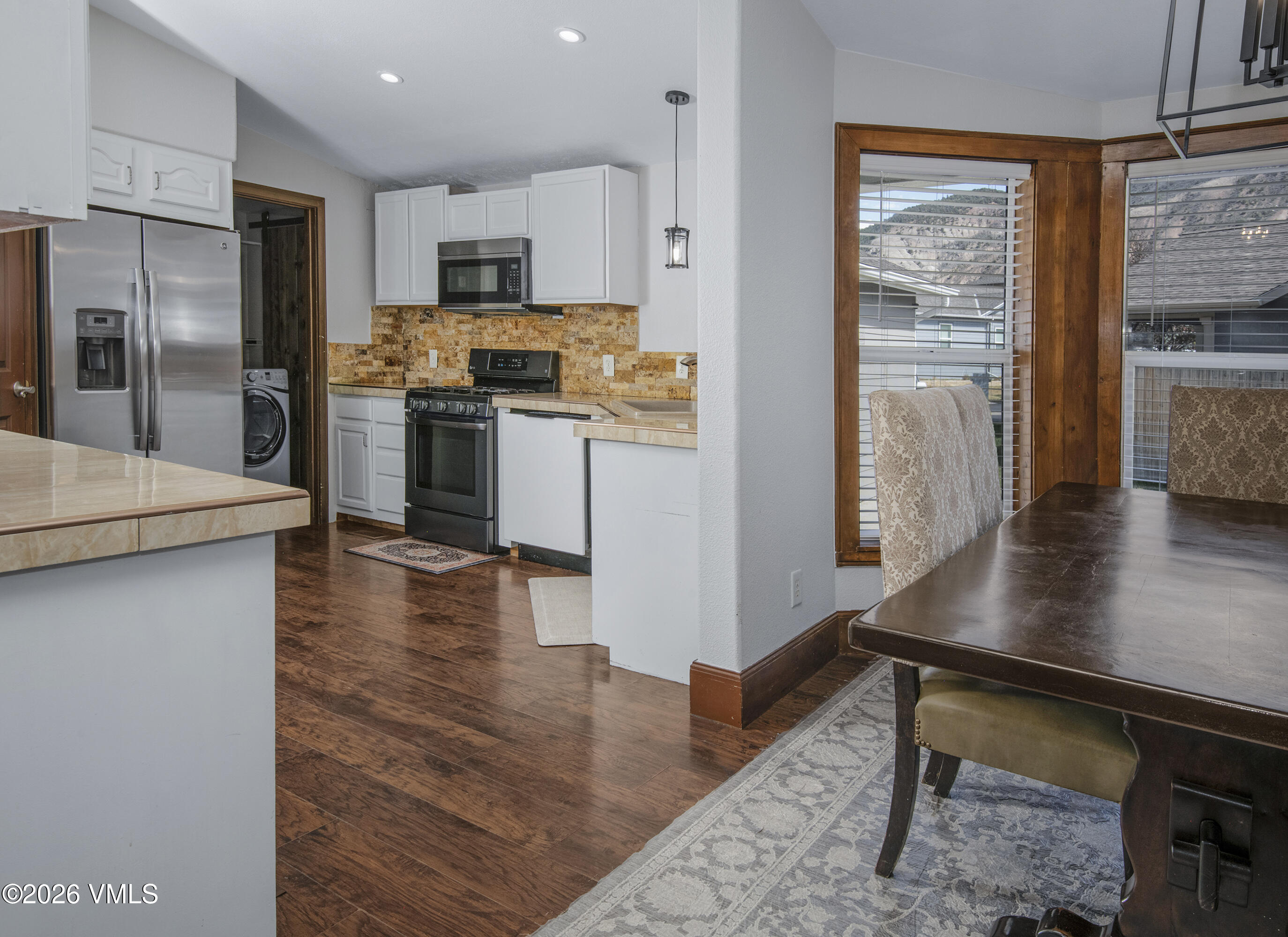 102 Cut Throat Loop Gypsum, CO 81637 - Photo 4 of 37 a kitchen with kitchen island a counter top space a sink stainless steel appliances and cabinets
