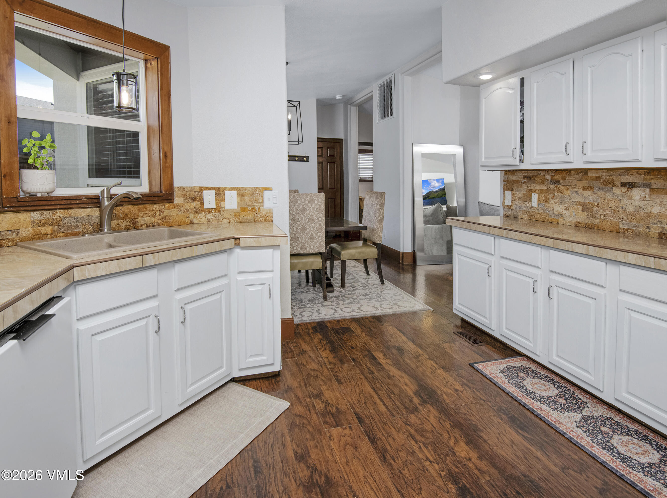 102 Cut Throat Loop Gypsum, CO 81637 - Photo 7 of 37 a kitchen with a sink and cabinets