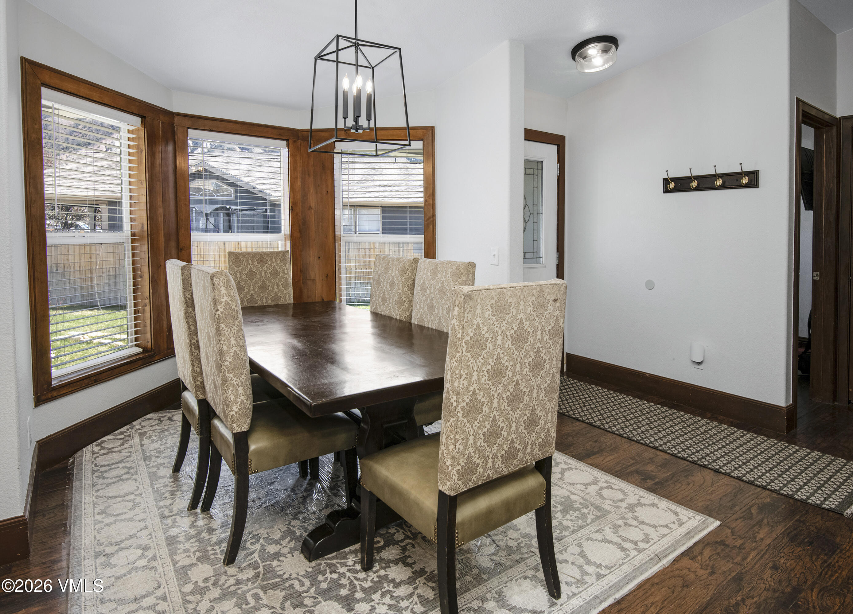 102 Cut Throat Loop Gypsum, CO 81637 - Photo 8 of 37 a view of a dining room with furniture window and wooden floor