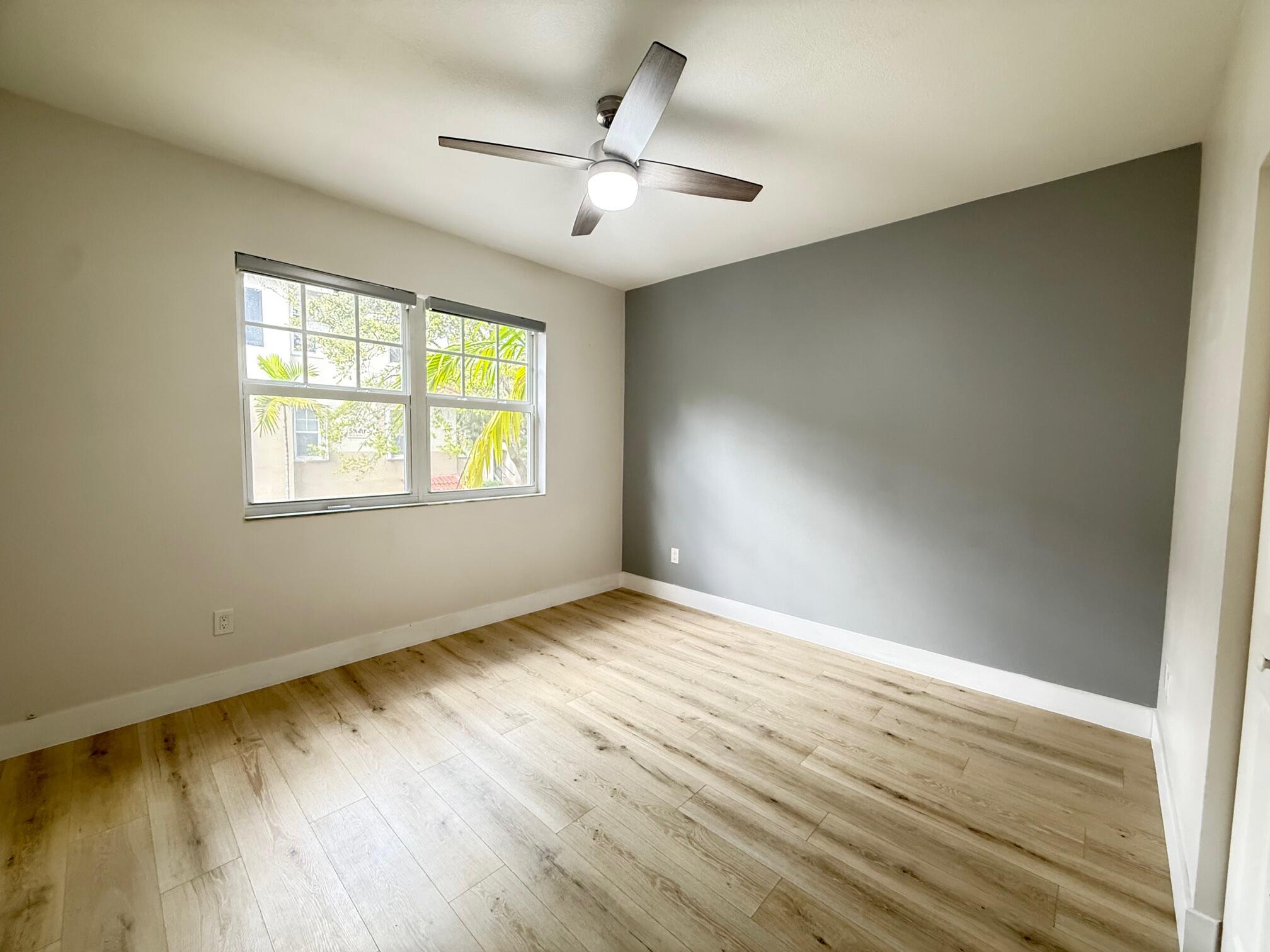 5860 West Sample Road, Unit 202 Coral Springs, FL 33067 - Photo 15 of 26 a view of an empty room and window