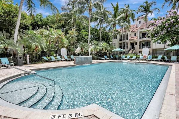 a view of a swimming pool with a patio