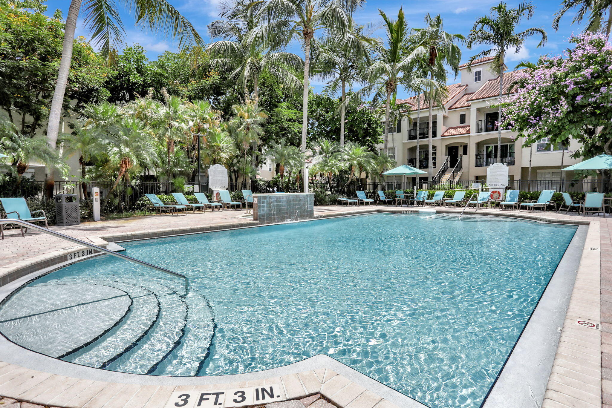 5860 West Sample Road, Unit 202 Coral Springs, FL 33067 - Photo 19 of 26 a view of a swimming pool with a patio