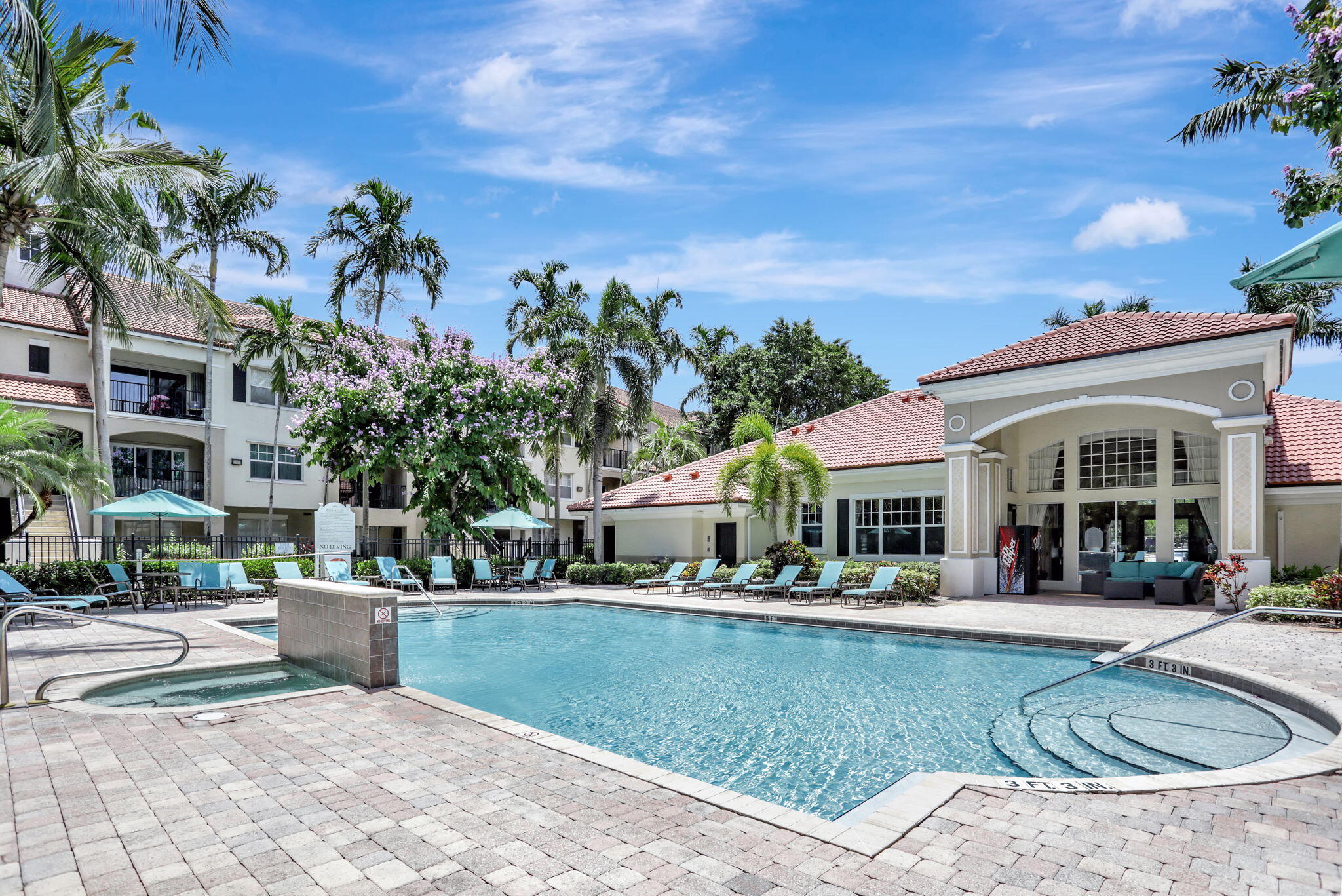 5860 West Sample Road, Unit 202 Coral Springs, FL 33067 - Photo 20 of 26 a view of a building with a swimming pool
