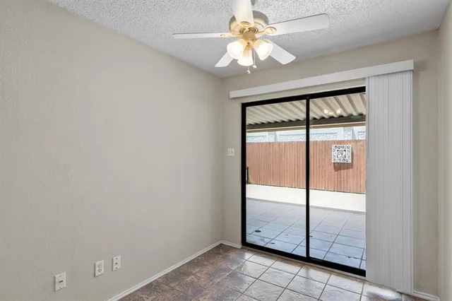 a view of a backyard with plants and a patio