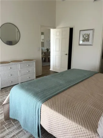 a bedroom with a bed and a cabinets