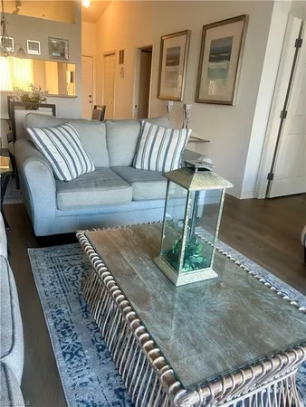 a living room with a couch and a rug