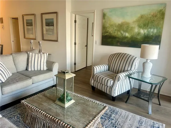 a living room with furniture and a rug