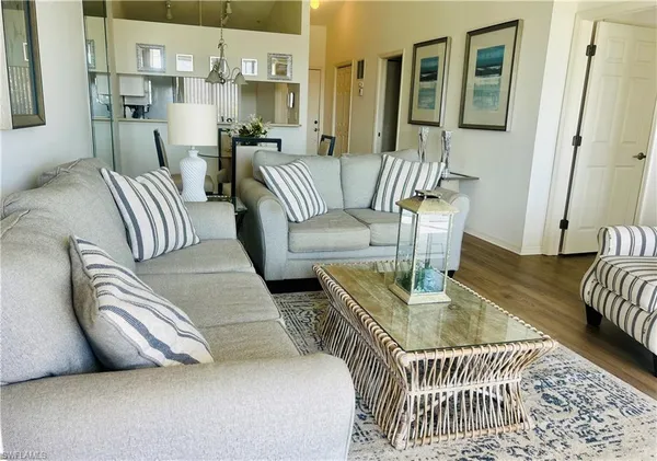 a view of a bedroom with furniture