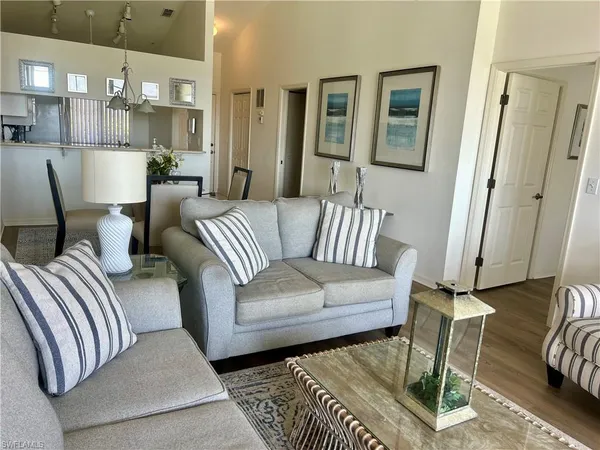 a living room with furniture and a rug