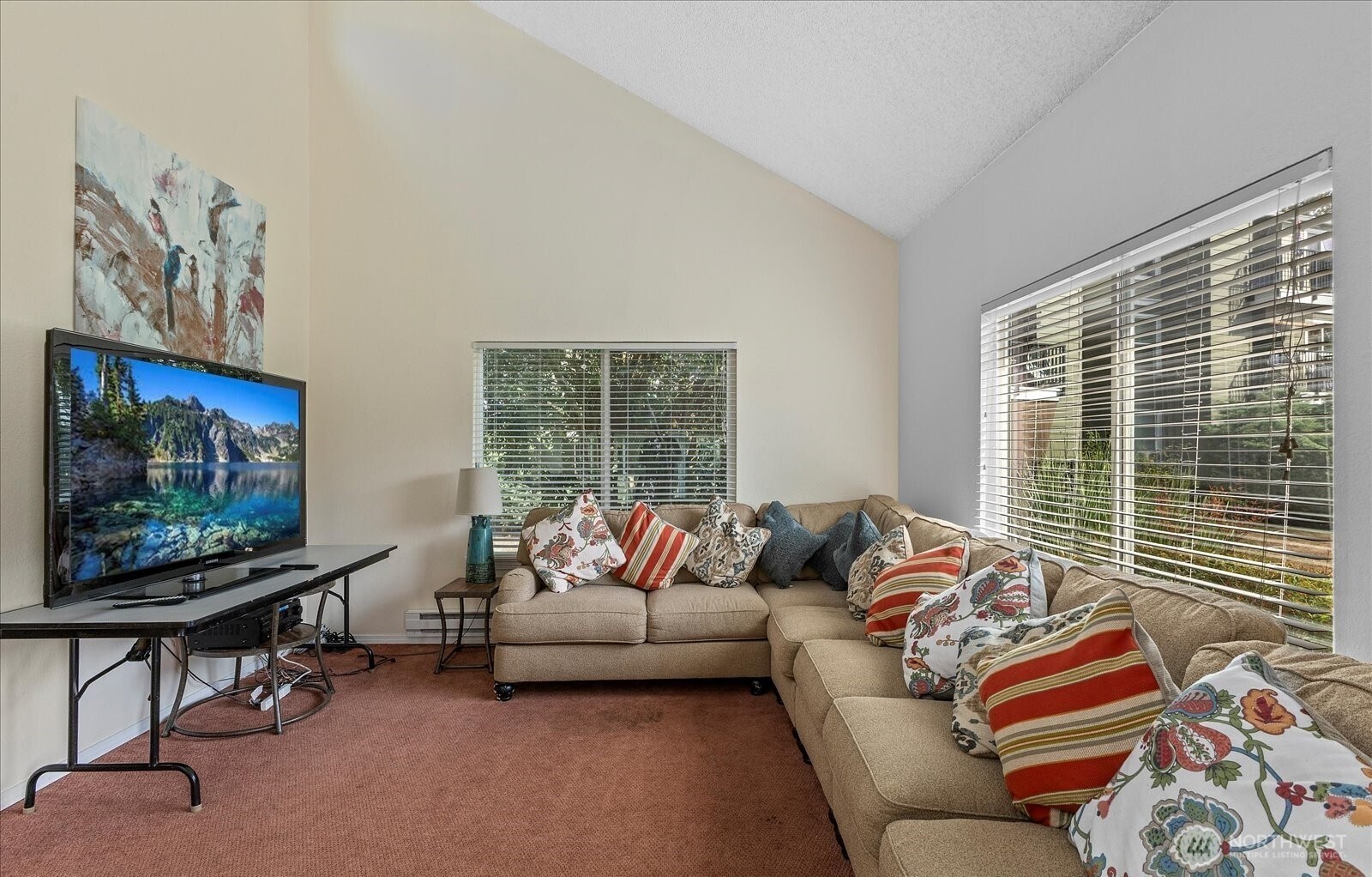 820 Cady Road, Unit H101 Everett, WA 98203 - Photo 30 of 31 a living room with furniture and a flat screen tv