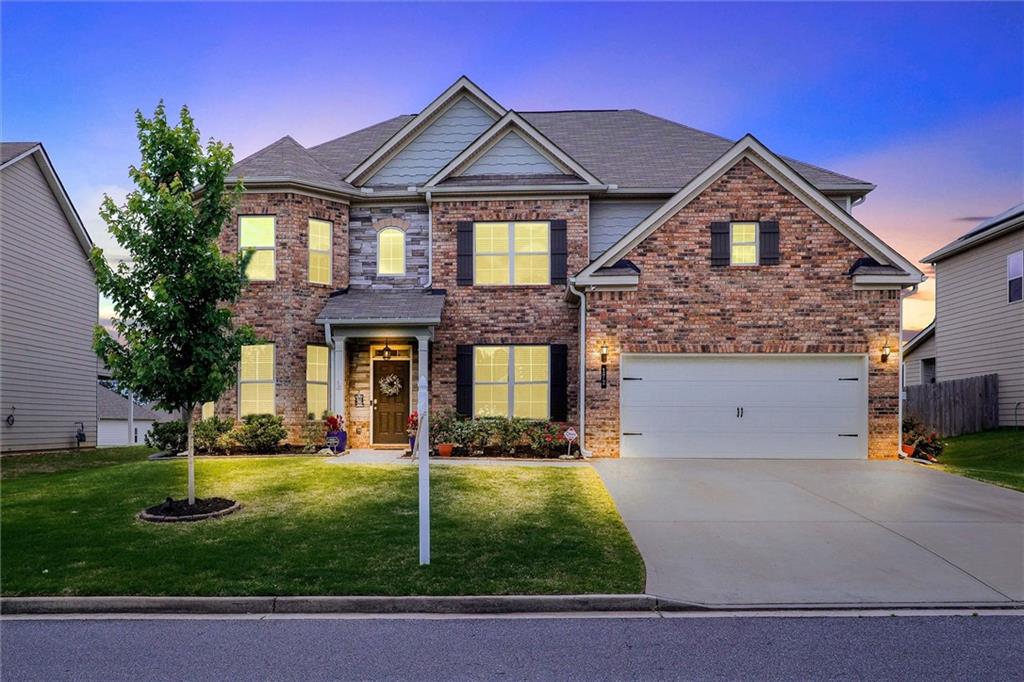 front view of a house with a yard