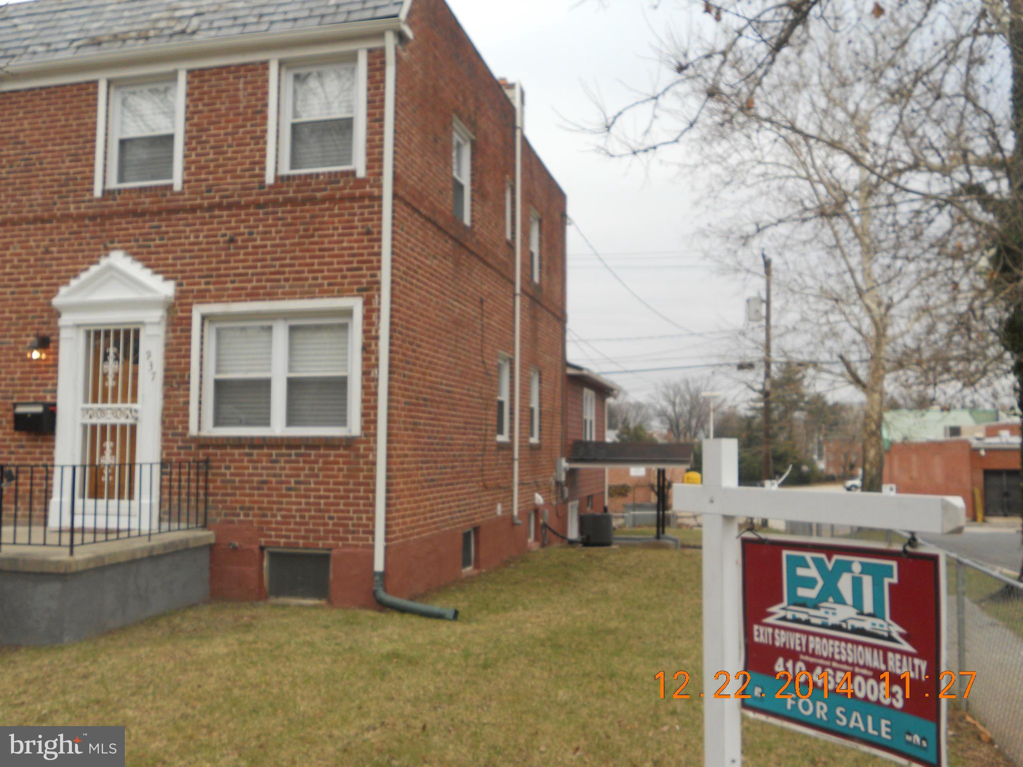 937 Coleridge Road Baltimore, MD 21229 - Photo 1 of 16 a front view of a house with a yard