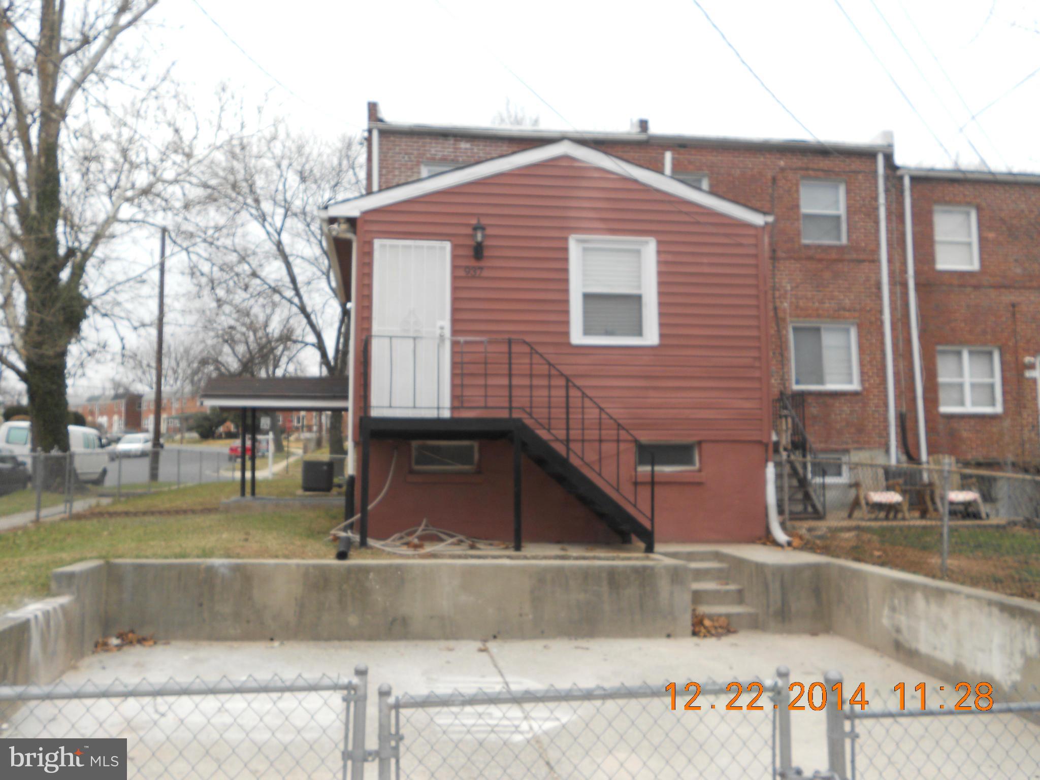 937 Coleridge Road Baltimore, MD 21229 - Photo 3 of 16 a front view of a house with a yard