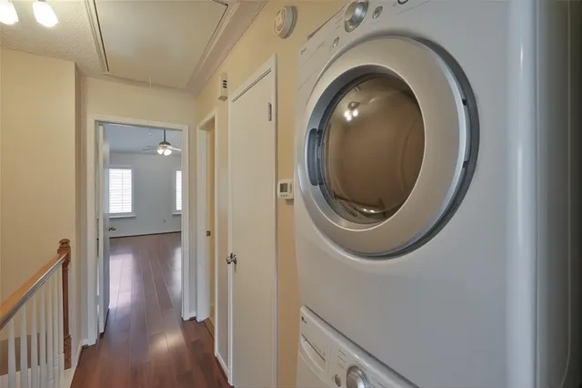 a view of a hallway with washer and dryer