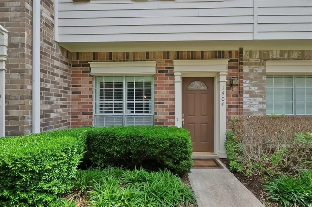 a view of front door of house with stairs
