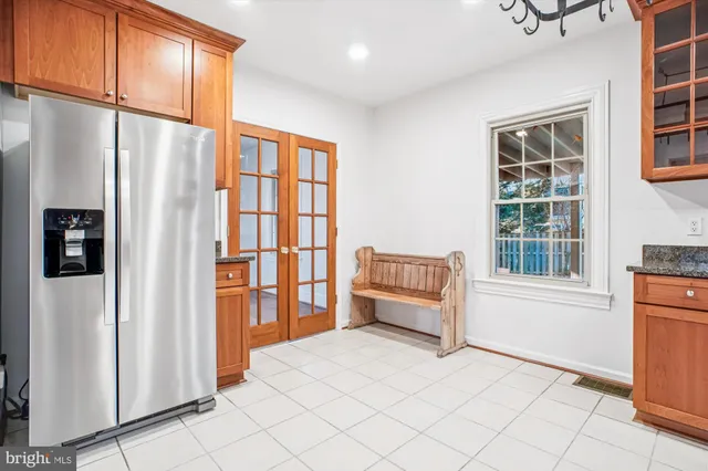 a view of a room with wooden floor and window